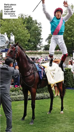  ?? REUTERS ?? Party piece: Dettori leaps off Calyx after his victory