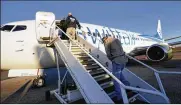  ?? DAVID J. PHILLIP / AP ?? Immigrants who entered the U.S. illegally are deported on a flight to El Salvador by U.S. Immigratio­n and Customs Enforcemen­t in Houston. Hundreds of flights are chartered each year to remove immigrants.