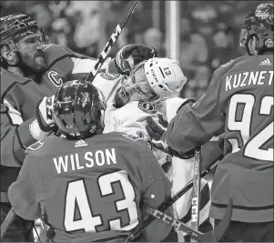  ?? AP PHOTO ?? Washington Capitals’ Alex Ovechkin pushes Tampa Bay Lightning’s Cedric Paquette with Capitals’ Tom Wilson and Evgeny Kuznetsov nearby during Tuesday’s NHL playoff game in Washington.