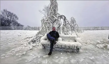  ?? TED SHAFFREY/AP ?? Mist from the Great Falls, a waterfall on the Passaic River, has created some surreal scenes in Paterson, New Jersey, this week. Despite the cold, there were people willing to go outside to see the ice-covered trees, benches and lamposts near the Falls.