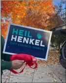  ?? COURTESY PHOTO, BROOMFIELD COUNTY DEMOCRATS ?? One of two edited Henkel campaign signs found in Broomfield last week.