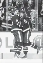  ?? CHRIS YOUNG THE CANADIAN PRESS ?? Zach Hyman, left, helps rookie Andreas Johnsson celebrate after the rookie scored his first NHL goal and his team’s fourth against the Montreal Canadiens.