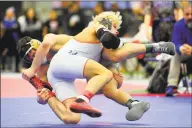  ?? Christian Abraham / Hearst Connecticu­t Media ?? Danbury’s Ryan Jack wrestles against Bristol Eastern’s Thomas Nichols during CIAC State Open in New Haven on Saturday. Danbury won its fourth consecutiv­e title.