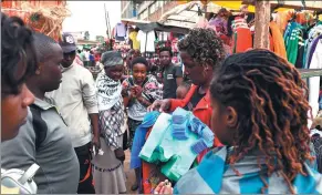  ?? LI BAISHUN / XINHUA NEWS AGENCY ?? A vendor sells shopping bags made of non-woven fabrics in a market in Nairobi, Kenya, on Monday.