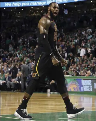  ?? ELISE AMENDOLA — ASSOCIATED PRESS ?? LeBron James celebrates as the Cavaliers pull away from the Celtics to win Game 7 of the Eastern Conference finals on May 27 in Boston.