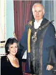  ?? ?? James Freeland, with his wife Diana, in the regalia of the Worshipful Company of Shipwright­s