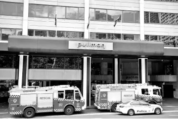  ??  ?? Emergency service workers at the scene of a chemical leak at the Pullman Hotel in Sydney, Australia. — Reuters photo