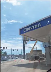  ?? / Kevin Myrick ?? It’s been out of order for a while, but the gas sign at the corner of East Avenue and Main Street for the Chevron in downtown Cedartown was finally getting a new lease on life with repairs being completed on Thursday, June 28. The sign joins a growing...