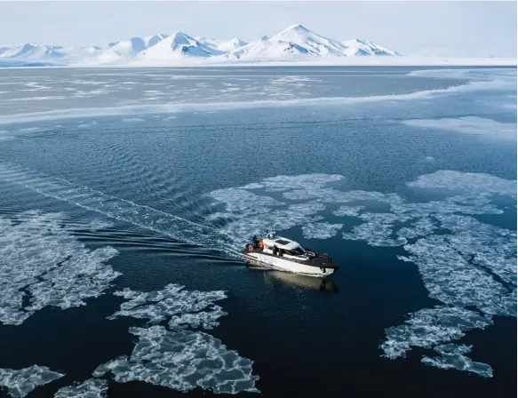  ?? AFP ?? A tourist boat makes its way near sea ice in the Svalbard Archipelag­o of Norway. Ice cover has been declining in the Arctic region as a result of global warming