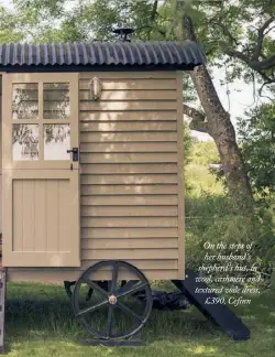  ??  ?? On the steps of her husband’s shepherd’s hut, in wool, cashmere and textured voile dress,£390, Cefinn