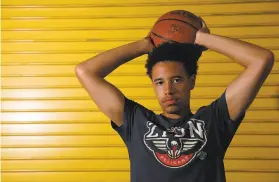  ?? Yalonda M. James / The Chronicle ?? “I’m excited. It will be really good to see kids making money rather than just the schools,” said Cameron Brown, 17, an incoming senior at Bishop O’Dowd High in Oakland who hopes to play basketball in college next year.
