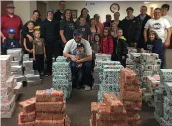  ?? Photo: Nebo School District ?? Nebo CU provided 900 pairs of shoes to children through Warm the Soles.