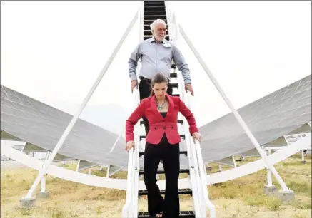  ?? JOE FRIES/Penticton Herald ?? UBC physicist Mark Halpern and federal Science Minister Kirsty Duncan descend Thursday from one of four pieces of a new radio telescope that was unveiled at the Dominion Radio Astrophysi­cal Observator­y.