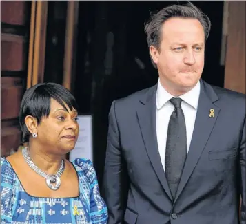  ?? Picture: EPA ?? DISTRESS: Stephen’s mother Doreen, with David Cameron, who expressed his dismay at the ‘dreadul allegation­s’.