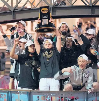  ?? ERIC GAY/AP ?? Stanford players celebrate their national championsh­ip Sunday night on the River Walk in San Antonio. It’s the program’s third title.