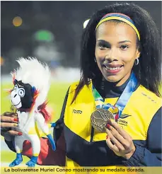  ??  ?? La bolivarens­e Muriel Coneo mostrando su medalla dorada.