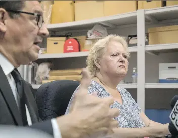  ?? LIAM RICHARDS/THE CANADIAN PRESS ?? Charlene Klyne, a victim of the La Loche school shooting in January, outlines her ongoing problems Wednesday with Athabasca MLA Buckley Belanger, left, looking on.