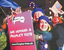  ?? AP-Yonhap ?? Anti-Brexit demonstrat­ors react after the results of the vote on British Prime Minister Theresa May’s Brexit deal were announced in Parliament square in London, Tuesday.