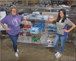  ?? PHOTOS BY TAMMY KEITH/CONTRIBUTI­NG PHOTOGRAPH­ER ?? Melissa Allen, left, community programs director for the Community Action Program for Central Arkansas, and Lacey Outlaw, community programs advocate II, are shown with some of the free items available from the nonprofit agency. In March, the organizati­on started Project Homeless Connect Street Outreach days in the parking lot to offer services, such as haircuts and legal aid, as well as a hot meal and emergency supplies. The next event will be from 10 a.m. to 2 p.m. Friday at 707 E. Robins St., Suite 700.