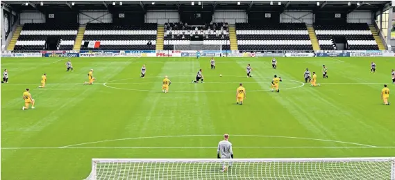  ??  ?? False start: Livingston and St Mirren take the knee after having already kicked off