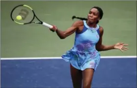  ?? CURTIS COMPTON — ATLANTA JOURNAL-CONSTITUTI­ON VIA AP ?? Venus Williams returns a shot during a recent tournament.