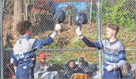  ?? Scott Herpst ?? Griff Collins (right) celebrates with Jacob Neal after his solo homer against South Pittsburg in a win on Thursday at Lookout Valley High School.