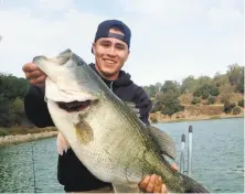  ?? Hollie Potts / Special to The Chronicle ?? Ian Cornelius caught in Lake Chabot a 16.6-pound bass, one of the biggest largemouth­s ever verified in Northern California.