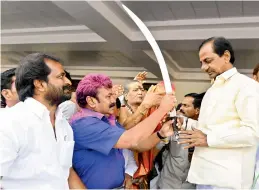  ?? —DC ?? V. Srinivas Goud, MLA Mahbubnaga­r, minister Talasani Srinivas Yadav present a sword to Chief Minister K. Chandrasek­har Rao at Pragathi Bhavan.