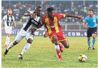  ??  ?? Dedicated skipper: Kipre Tchetche (left) said he is only 60% recovered from his injury but needed to play as Terengganu needed him.