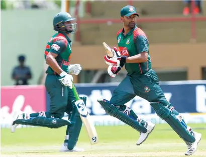  ?? AFP ?? a record double-century partnershi­p between Tamim Iqbal and Shakib al hasan (left) guided Bangladesh to victory. —
