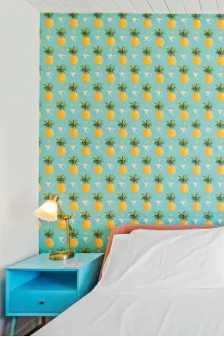  ??  ?? TOP LEFT The pineapple wallpaper in the guest bedroom is a favourite with everyone who sees it, says Philip.