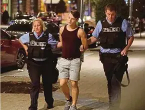  ?? REUTERS PIC ?? Police officers detaining a demonstrat­or in St Louis, the United States, on Sunday.