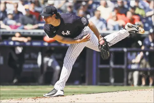  ?? Frank Franklin II / Associated Press ?? The New York Yankees’ Gerrit Cole delivers a pitch during the second inning of a spring training game against the Detroit Tigers in Tampa, Fla., in February.