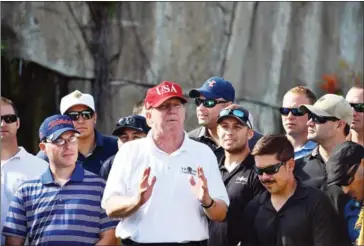  ?? NICHOLAS KAMM/AFP ?? US President Donald Trump speaks to service members of the United States Coast Guard during an invitation to play golf at Trump Internatio­nal Golf Course in Mar-a-Lago, Florida, on Friday.