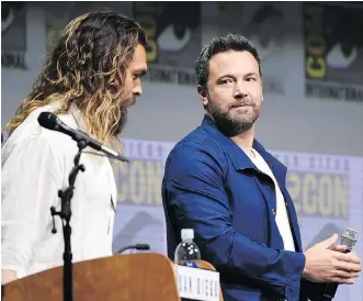  ?? RICHARD SHOTWELL/THE ASSOCIATED PRESS ?? Ben Affleck, right, seen with Jason Momoa during a Comic-Con Internatio­nal panel over the weekend, says despite rumours to the contrary he will play Batman in an upcoming film.