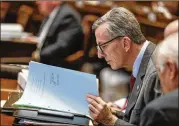  ?? BOB ANDRES / BANDRES@AJC.COM ?? Sen. Jesse Stone, R-Waynesboro, reads over legislativ­e proposals and other documents Tuesday during the 11th day of the General Assembly’s 40-day 2020 session.