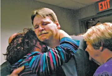  ?? HEATHER AINSWORTH, AP FILE PHOTO ?? Steven Barnes receives a hug from sister Lisa Pawloski, beside his mother Sylvia Bouchard, right, in November 2008 moments after Barnes was released from prison in Utica, N.Y. Family and friends packed the Oneida County Court room for the hearing where...