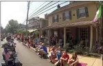  ?? COURTESY OF SKIPPACK VILLAGE ?? Attendees watch a previous Fourth of July parade in downtown Skippack.