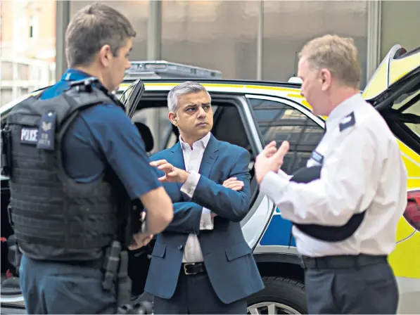  ??  ?? Sadiq Khan, the Mayor of London, during a visit to Scotland Yard – campaigner­s say the Met, overseen by Mr Khan, is wasting taxpayers’ money