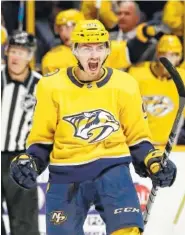  ?? THE ASSOCIATED PRESS ?? Nashville Predators defenseman Samuel Girard celebrates after scoring a goal against the Dallas Stars in the second period of their game Thursday in Nashville.