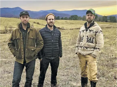  ?? BY JOHN MCCASLIN ?? Jennings, Lain and Van Carney, seen here this week surveying the future site of their farm brewery and winery, are “thrilled” to take their Sperryvill­e enterprise in an “estate grown” direction.