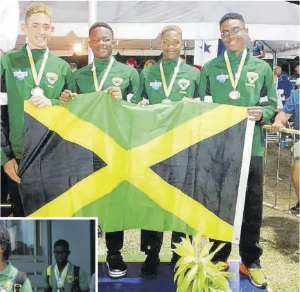  ??  ?? Jamaica’s bronze medal winning 13-14 boys team (from left) Daniel Mair, Kaheem Lozer, Jaedon Lynch, and Nathaniel Thomas are all smiles while proudly displaying the national flag on the final day of the 32nd CCCAN Swimming Championsh­ips in Barbados on Tuesday.