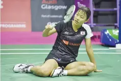  ??  ?? Japan’s Nozomi Okuhara slips as she plays against India’s Sindhu Pusarla during their women’s singles final match during the 2017 BWF World Championsh­ips of badminton at Emirates Arena in Glasgow on August 27, 2017. - AFP photo