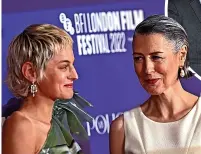  ?? ?? LEFT: Gina Mckee and Emma Corrin share a joke ABOVE: Gina with Rupert Everett and Linus Roache