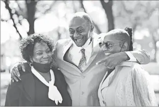  ?? ABEL URIBE/CHICAGO TRIBUNE ?? After the murder case against him abruptly was dropped Friday, Jackie Wilson embraces his wife, Sandra, left, and daughter, Candice, outside the Leighton Criminal Court Building.