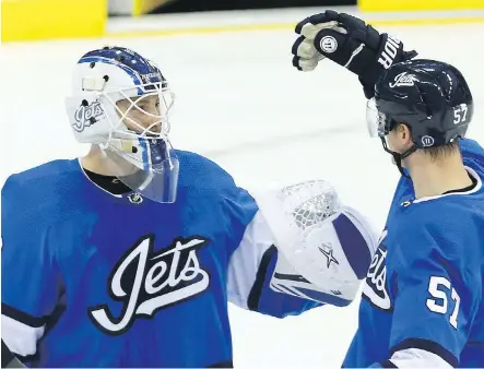  ?? KEVIN KING ?? The Jets celebrated a home-ice win over the Chicago Blackhawks on Tuesday night — another triumph over an NHL bottom dweller.