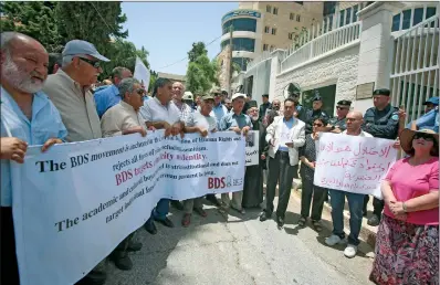  ?? (AFP) ?? Protesters stage a demonstrat­ion outside Germany’s Representa­tive Office in Ramallah in the Palestinia­n West Bank, on Wednesday, following the Bundestag’s (German parliament) condemnati­on of the Boycott, Divestment, Sanctions (BDS) movement as anti-Semitic.