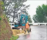  ??  ?? REDUCED TRAFFIC: Work underway to clear the slip at Pukeora Scenic Rd, which was reduced to one lane.