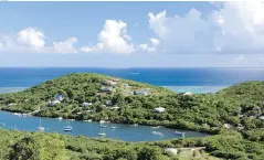 ??  ?? Sailboats dot Fulladoza Bay in Culebra, part of a 23-island archipelag­o off the eastern coast of Puerto Rico.