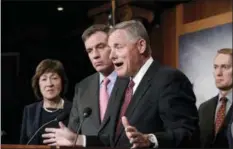  ?? J. SCOTT APPLEWHITE — THE ASSOCIATED PRESS ?? Senate Intelligen­ce Committee Chairman Sen. Richard Burr, R-N.C., center, joined from left by, Sen. Susan Collins, R-Maine, Vice Chairman Mark Warner, D-Va., and Sen. James Lankford, R-Okla., previews some of the panel’s recommenda­tions for improving...